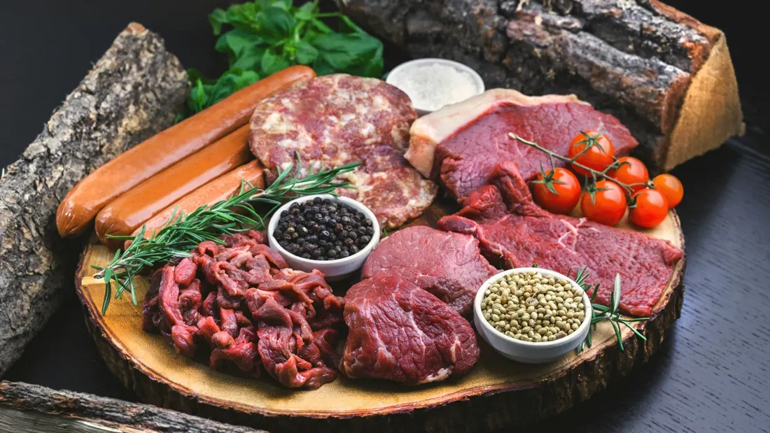 Board of fresh butchered cuts and sausage